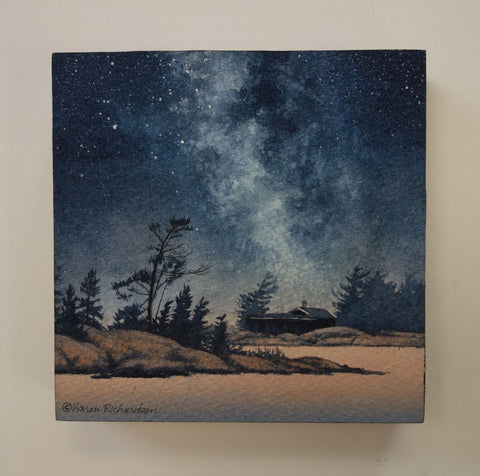 Painting of a starry night sky over a silhouette of trees and a cabin, titled Finding Peace, by Karen Richardson.