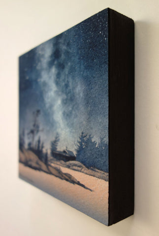 Painting of a starry night sky over a silhouette of trees and a cabin, titled Finding Peace, by Karen Richardson.