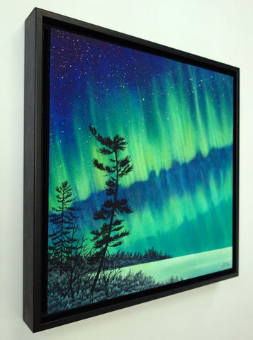 Guardian of the Sky by Karen Richardson.
Framed painting of aurora borealis over a silhouette of trees against a starry night sky.