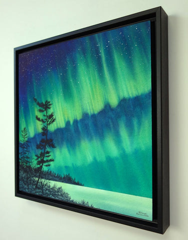 Guardian of the Sky by Karen Richardson.
Framed painting of aurora borealis over a silhouette of trees against a starry night sky.