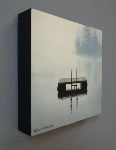 A serene watercolor painting of a small wooden raft floating on calm water, with soft gray-blue mist and trees in the background. Titled Lake Magic by Karen Richardson