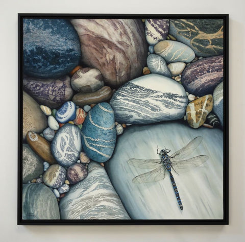 Love Changes Everything by Karen Richardson.
Framed artwork of pebbles with a dragonfly.