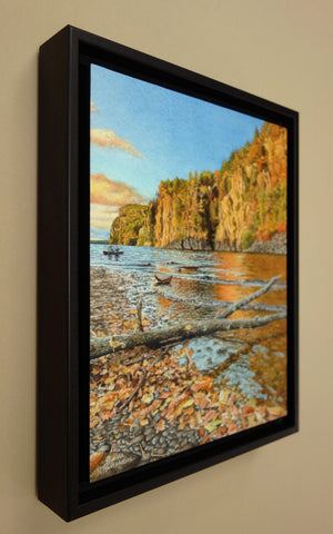 Framed landscape painting of a lake, cliffs, and trees with autumn colours, titled Mazinaw Majesty by Karen Richardson