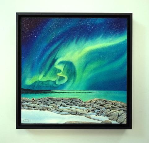 Rhythms of the Night by Karen Richardson.
Framed painting of northern lights over a rocky shoreline with water below.