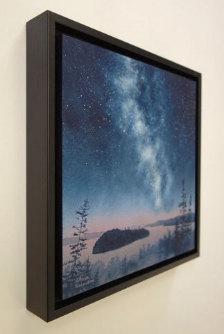 A painting of Lake Superior islands under a starry night sky with the Milky Way, titled Starlit Shores, by Karen Richardson.