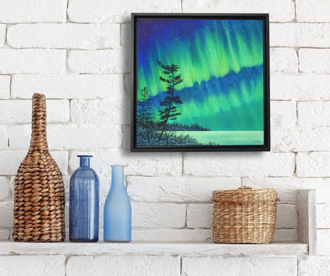 Framed painting Guardian of the Sky by Karen Richardson, shown on a white brick wall in a kitchen setting.