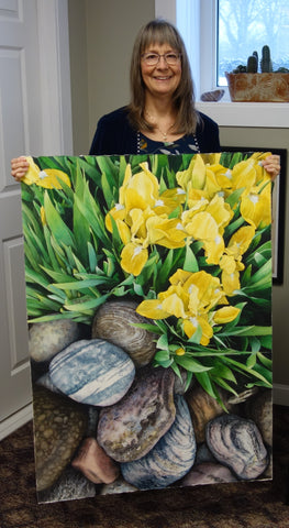 Karen Richardson with the book cover painting Where Garden Meets Rock