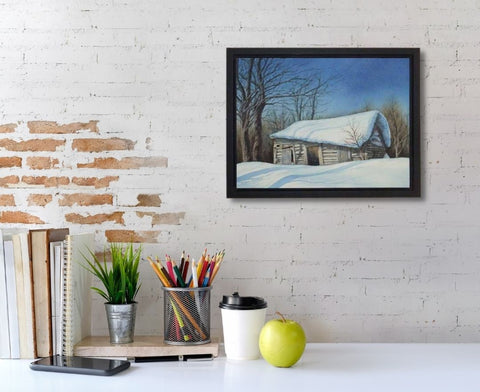 Cabin in the Snow, watercolour by Karen Richardson, shown above a desk