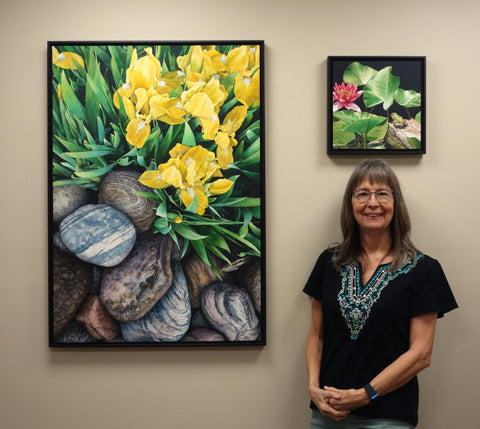 Karen Richardson beside her watercolour painting Where Garden Meets Rock